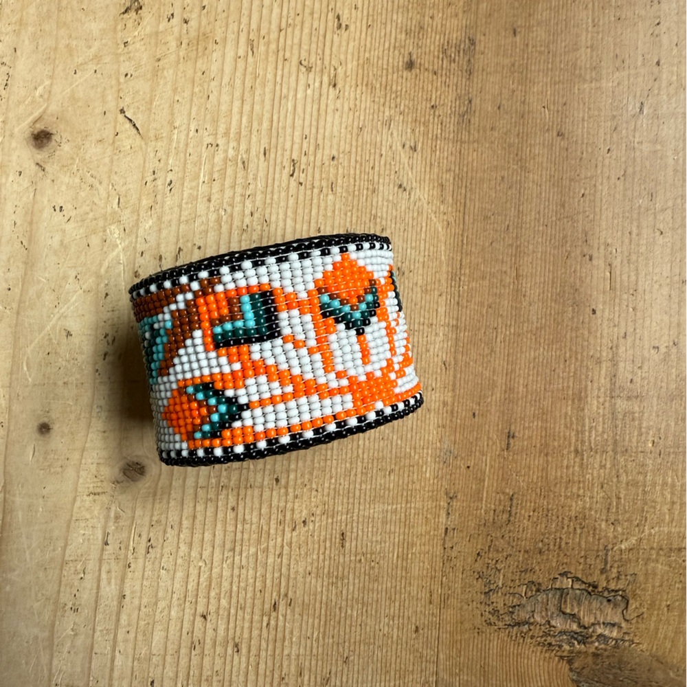 Beaded Bracelet with Orange and Black Pattern